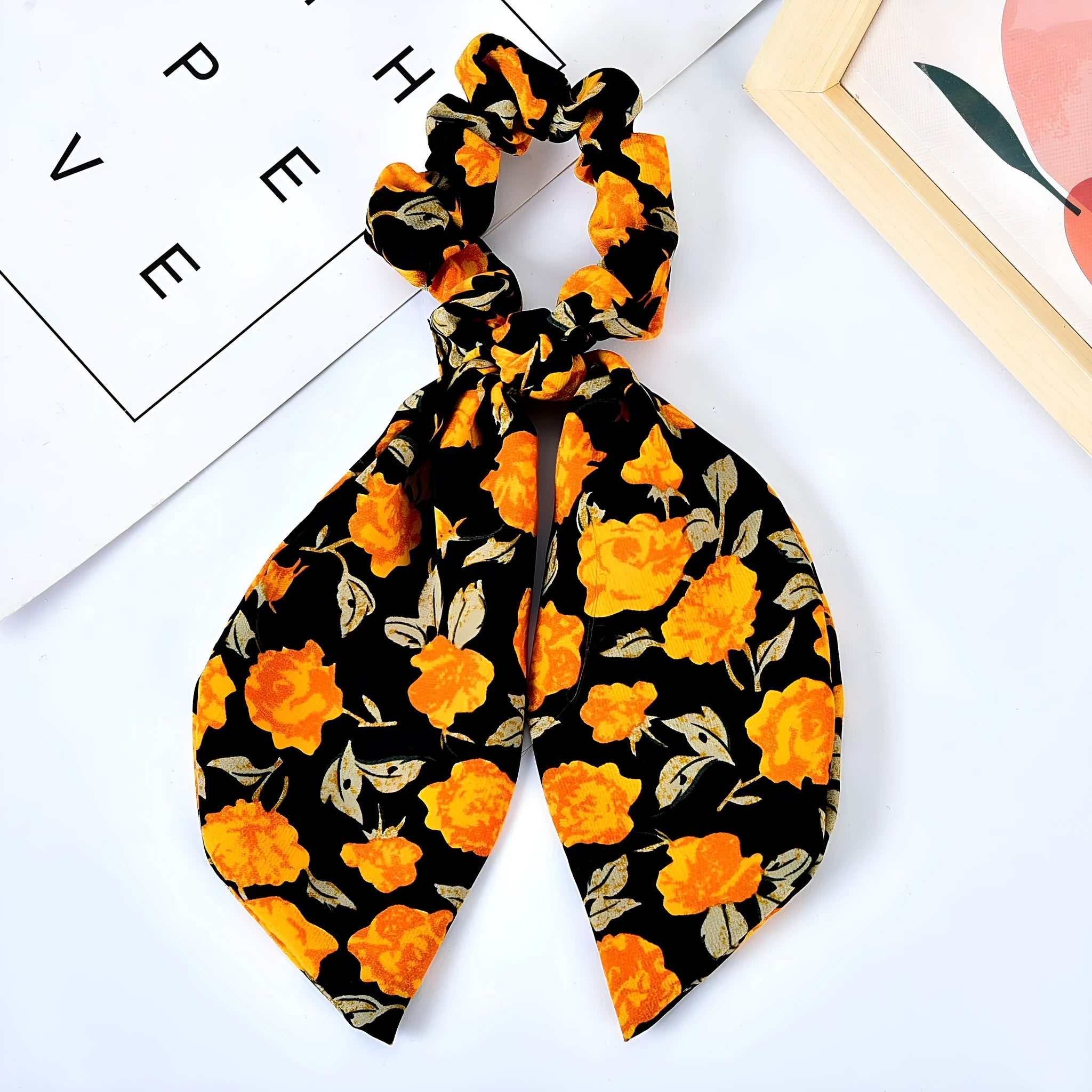Pearl hair tie with bowknot and broken flower design in cloth material, available in multiple ribbon colours