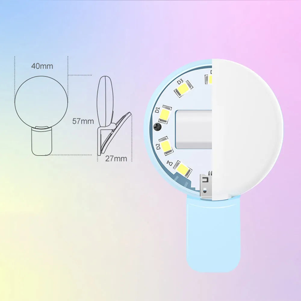 White round clip-on mini fill light attached to a mobile phone for selfies.