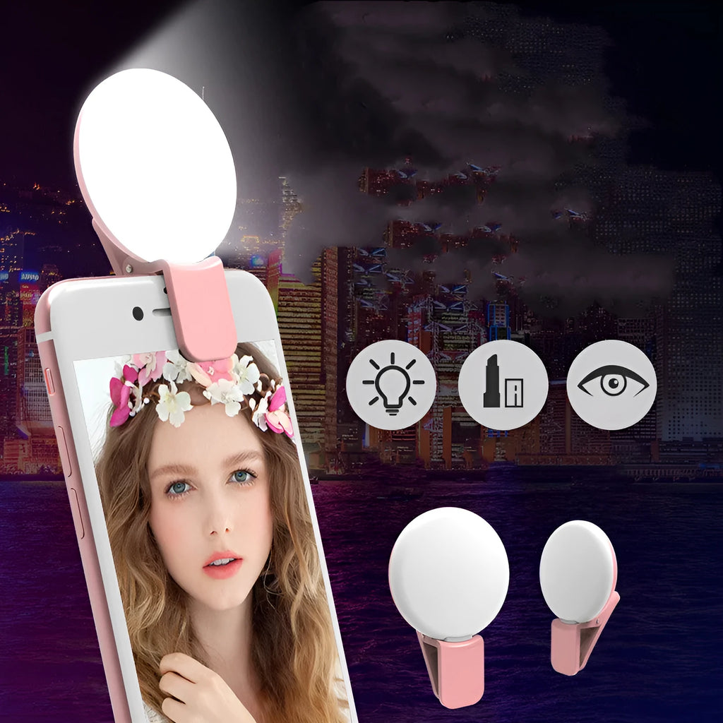 White round clip-on mini fill light attached to a mobile phone for selfies.