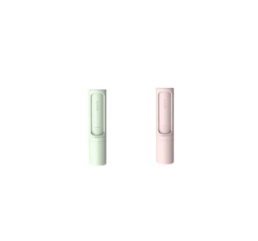 Rotating cylinder electrostatic pet hair removal brush in light pink with ABS body on a white background
