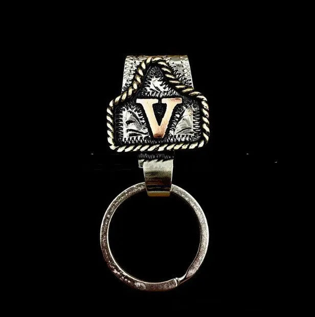 Handmade metal keychain with a cow tag charm in one of 26 available colour options.
