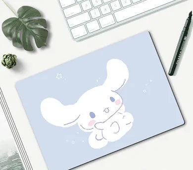 Cartoon character mouse pad on a desk, showing a colourful printed design with an anti-slip rubber base.