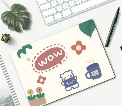 Cartoon character mouse pad on a desk, showing a colourful printed design with an anti-slip rubber base.