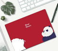 Cartoon character mouse pad on a desk, showing a colourful printed design with an anti-slip rubber base.
