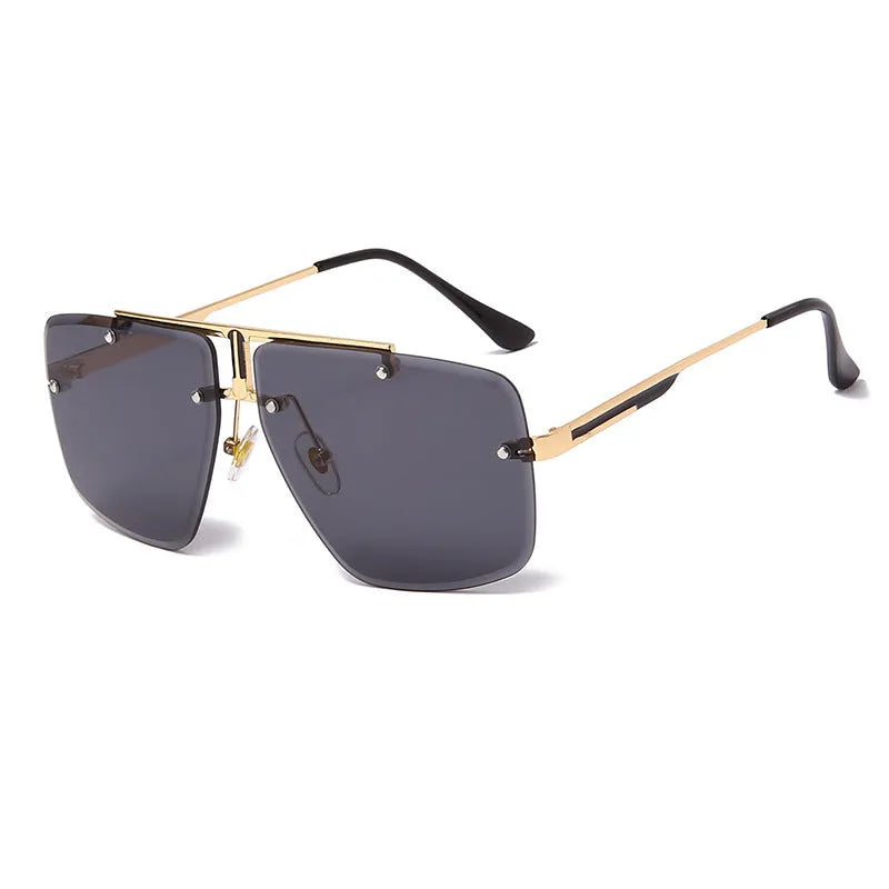 Frameless trim square sunglasses with metal frame and gray-blue PC lens on a flat surface