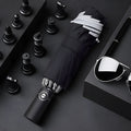 Black automatic reverse umbrella with reflective fabric shown open with 10 ribs