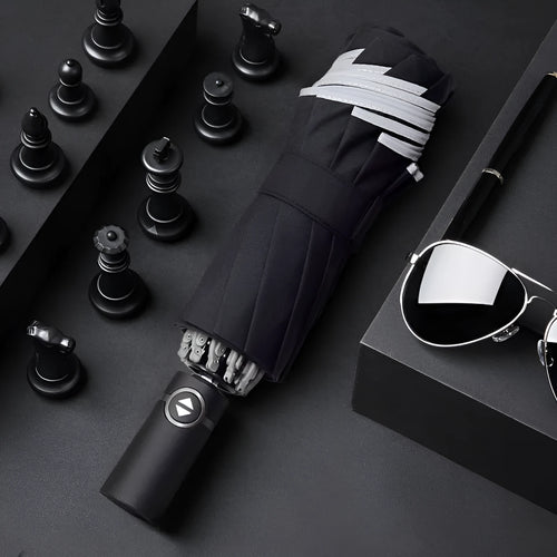 Black automatic reverse umbrella with reflective fabric shown open with 10 ribs