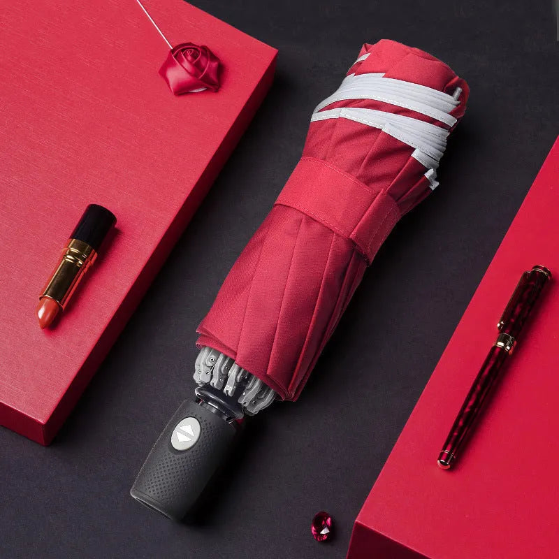 Black automatic reverse umbrella with reflective fabric shown open with 10 ribs