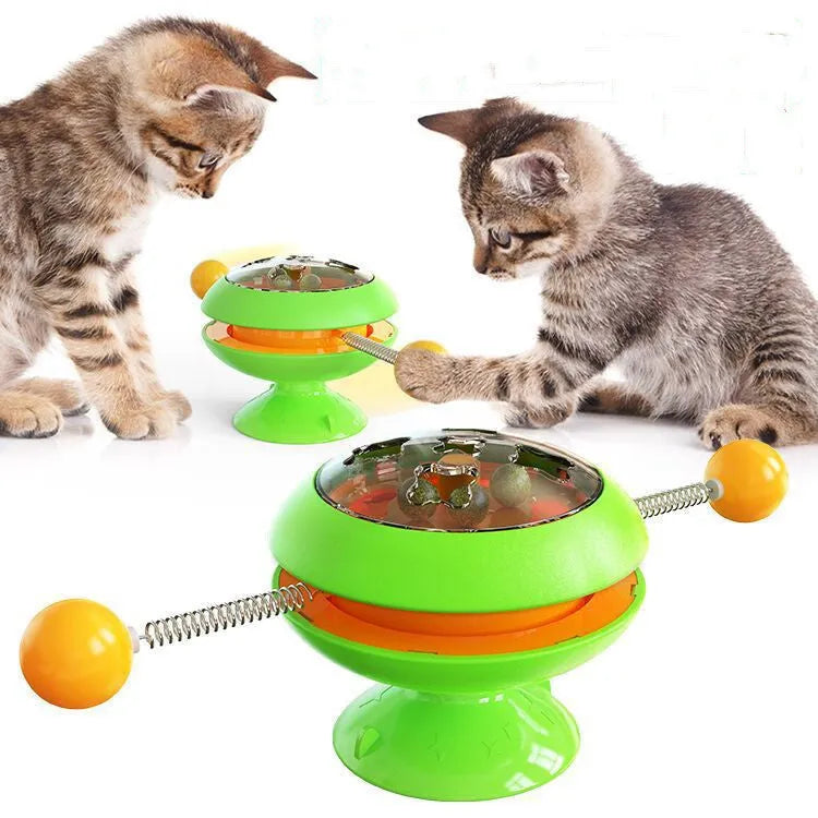 Rotatable interactive cat toy with catnip balls inside a transparent top and a large suction cup base, shown in lake blue.
