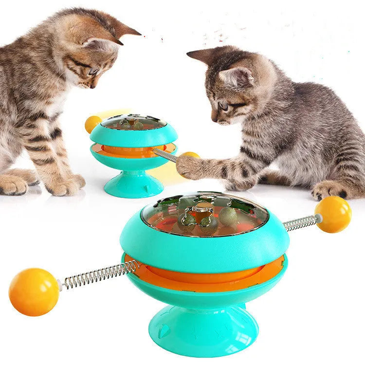 Rotatable interactive cat toy with catnip balls inside a transparent top and a large suction cup base, shown in lake blue.