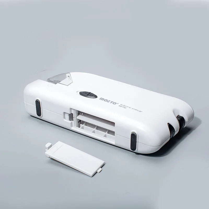 White electric flat stapler with automatic induction on desk, 184x45x84mm size