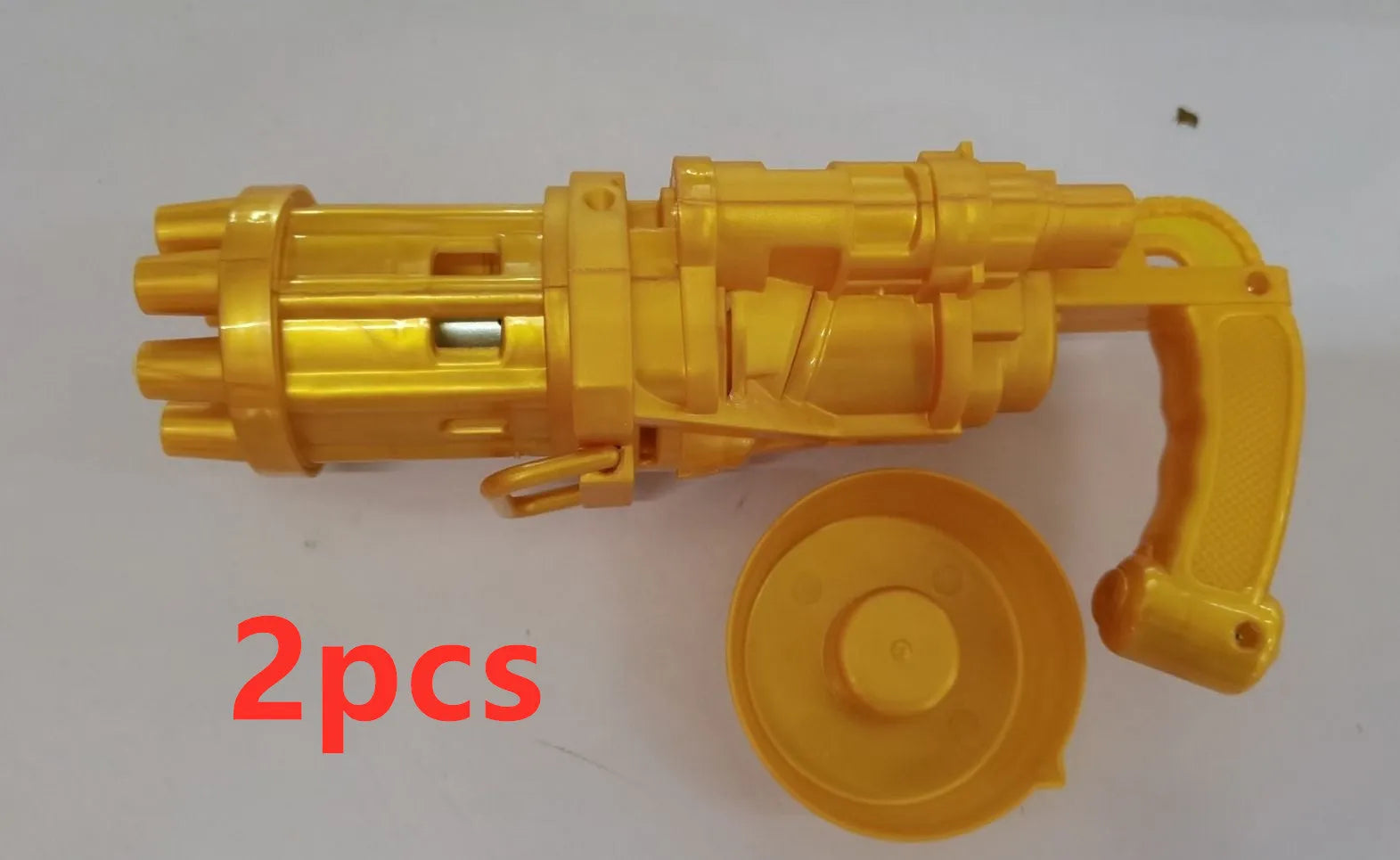 Realistic pink bubble machine gun toy for kids on a green lawn.