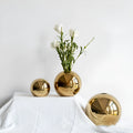 Handmade spherical electroplated ceramic gold vase on a tabletop, three sizes available for home decor