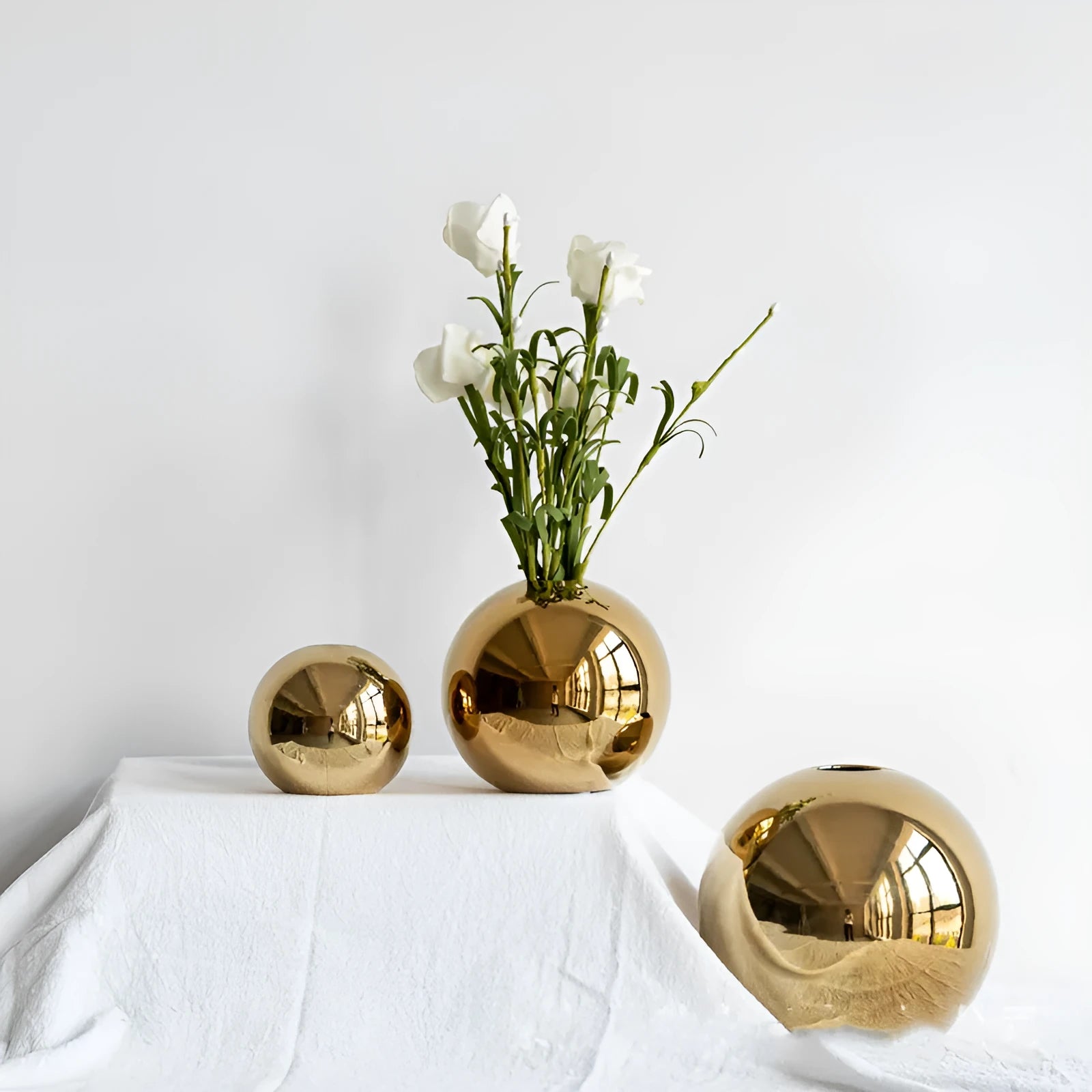 Handmade spherical electroplated ceramic gold vase on a tabletop, three sizes available for home decor