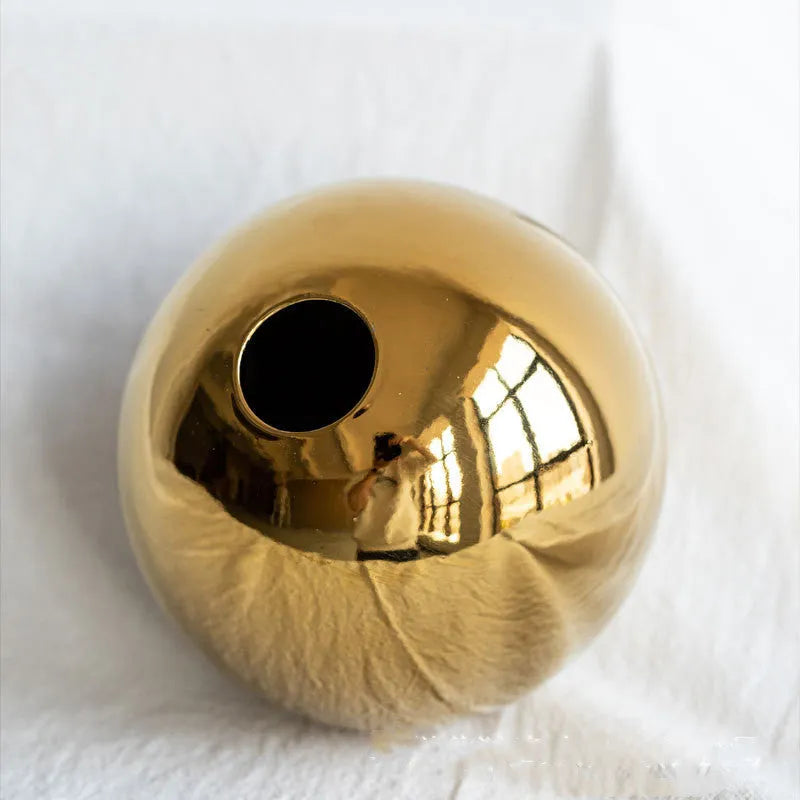 Handmade spherical electroplated ceramic gold vase on a tabletop, three sizes available for home decor