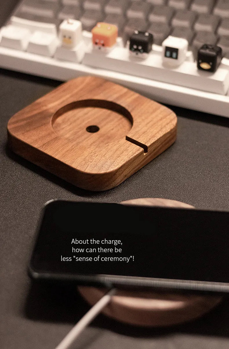 Walnut solid wood magnetic wireless charger bracket on desktop with phone attached