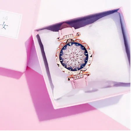 Women's full diamond bezel watch with round dial in multiple colour options showing pin buckle clasp