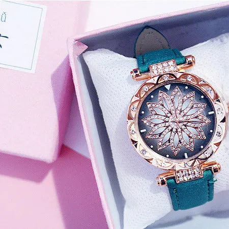 Women's full diamond bezel watch with round dial in multiple colour options showing pin buckle clasp