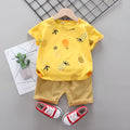 White cotton short-sleeve summer suit set for boys and girls with cartoon print, flat lay