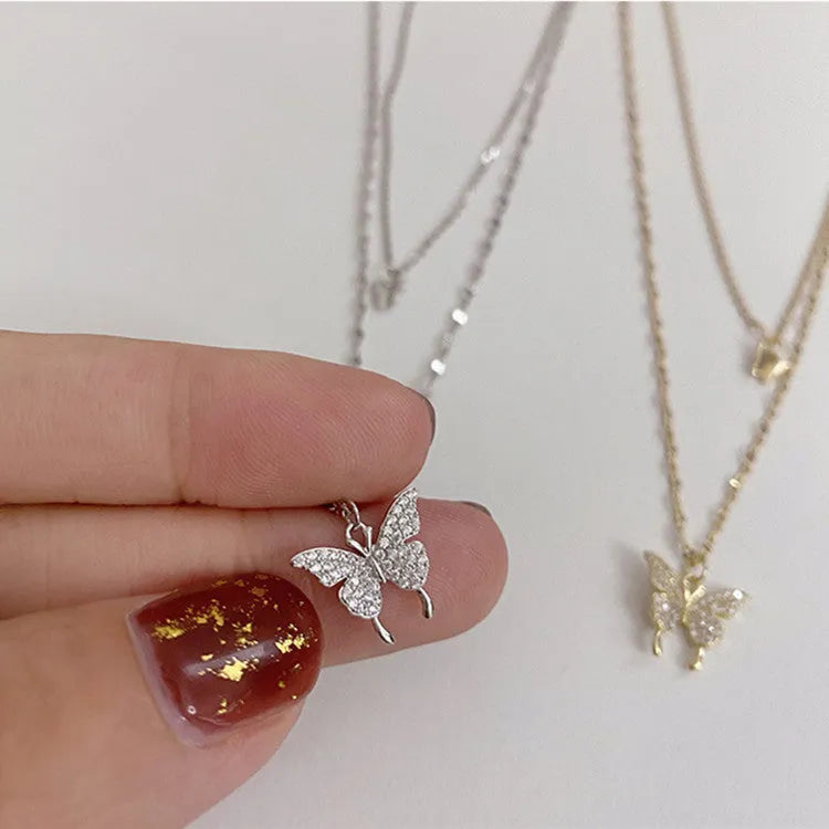 Silver colour double layer clavicle chain necklace with shiny butterfly pendant on copper base