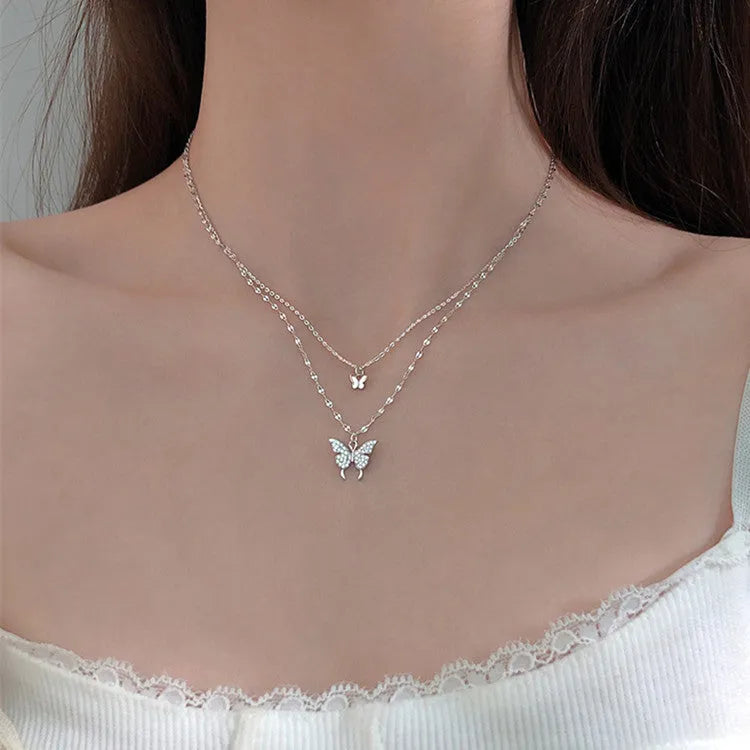 Silver colour double layer clavicle chain necklace with shiny butterfly pendant on copper base