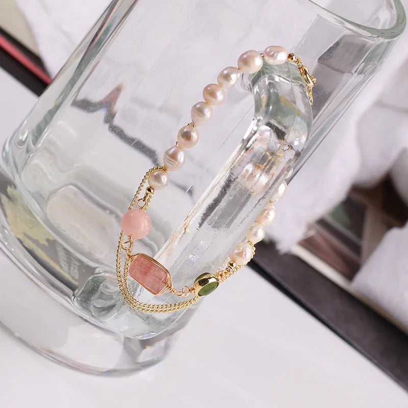 Women's freshwater pearl bracelet with strawberry crystal charms on geometric metal design