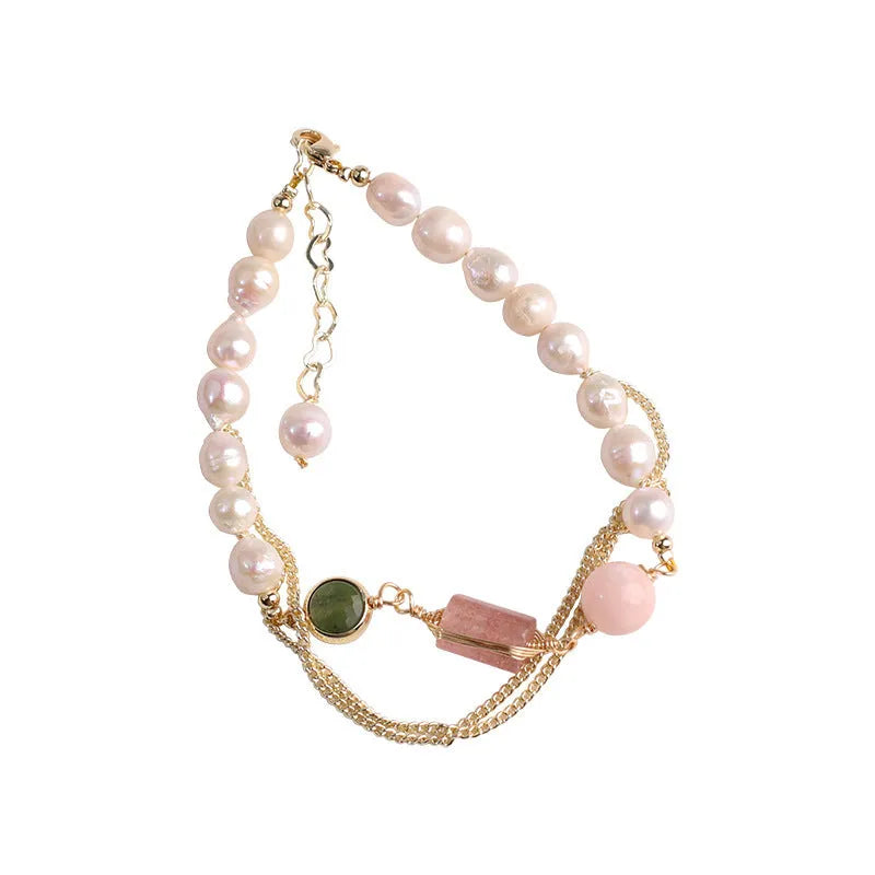 Women's freshwater pearl bracelet with strawberry crystal charms on geometric metal design