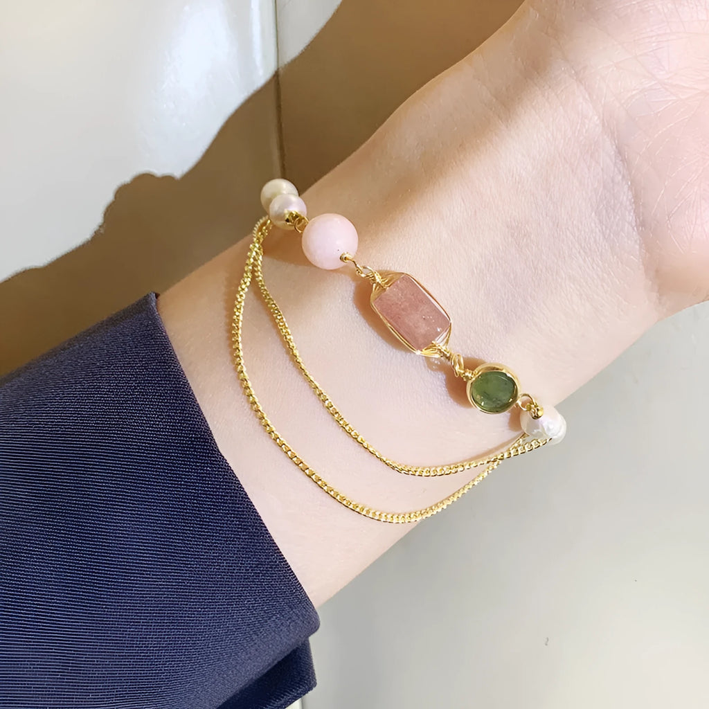 Women's freshwater pearl bracelet with strawberry crystal charms on geometric metal design