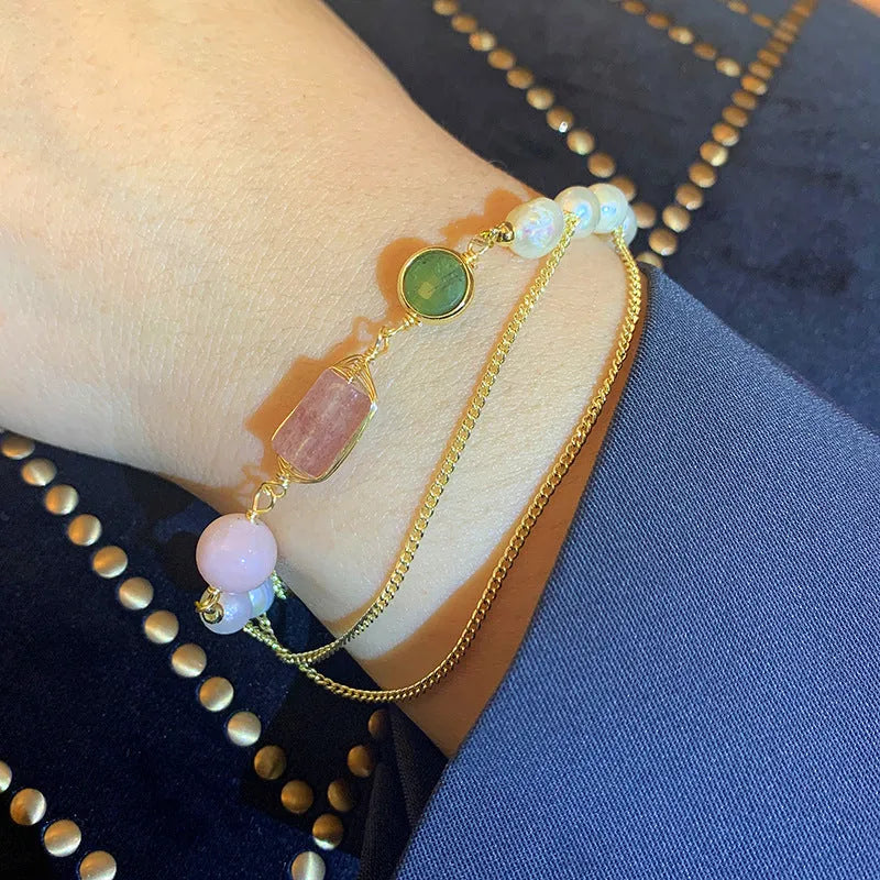 Women's freshwater pearl bracelet with strawberry crystal charms on geometric metal design
