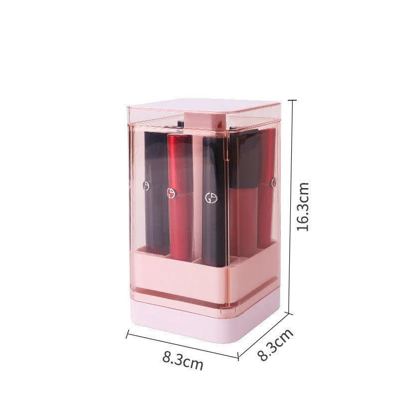 Press lift lipstick storage box with dust cover in pink colour on a desktop