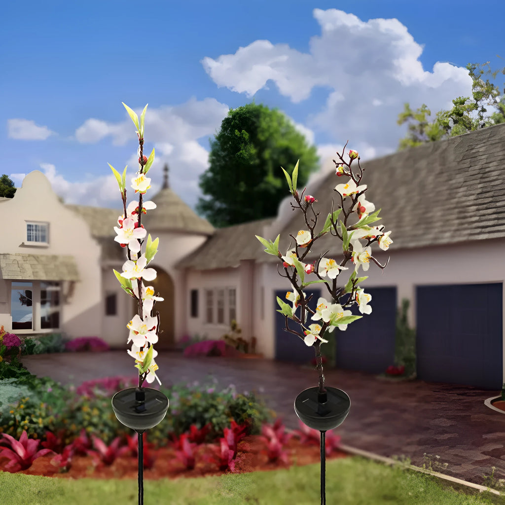 Solar-powered cherry blossom firework string lights with ground spike for outdoor garden decoration