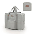 Cube-shaped travel storage bag in Oxford cloth, shown in black, grey, khaki, and pink colour options.