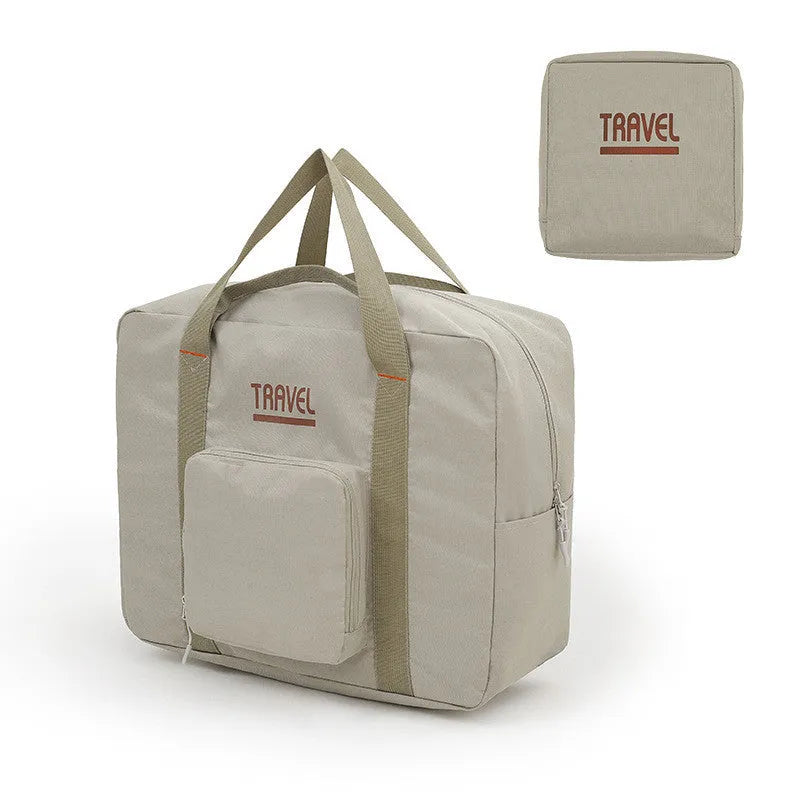 Cube-shaped travel storage bag in Oxford cloth, shown in black, grey, khaki, and pink colour options.