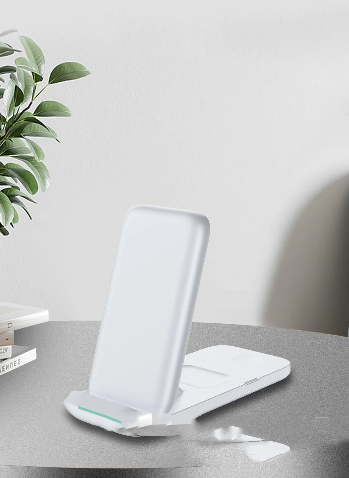 Black foldable three-in-one wireless charger showing charging pads for phone and earbuds