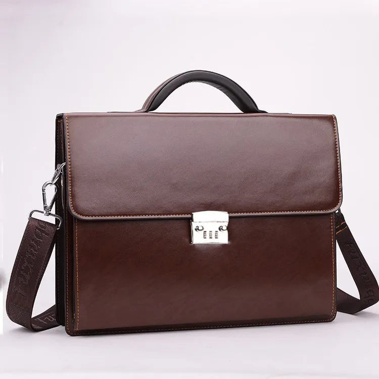 Black horizontal square men's business briefcase with shoulder strap and top handle, zipper open showing interior pockets.
