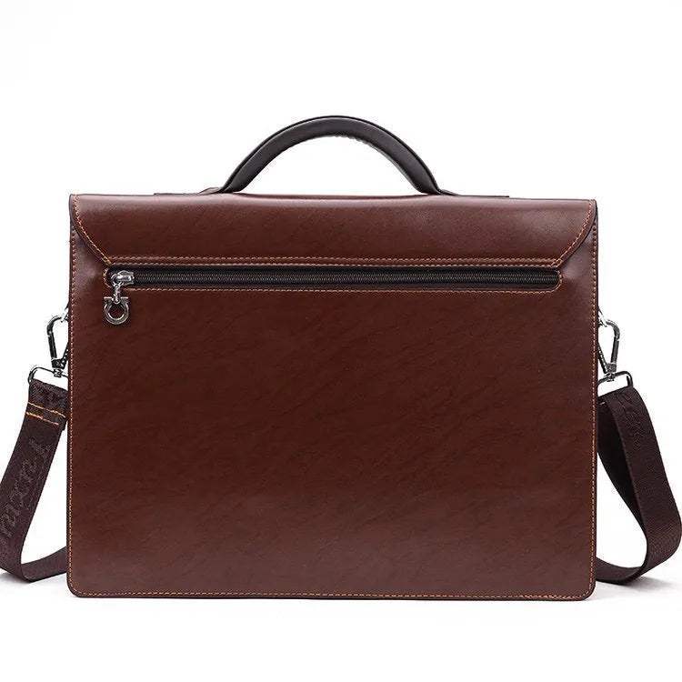 Black horizontal square men's business briefcase with shoulder strap and top handle, zipper open showing interior pockets.