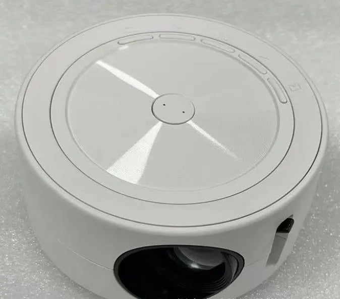 Wired home LED projector YT200 in compact 110x47mm casing with remote control and USB cord