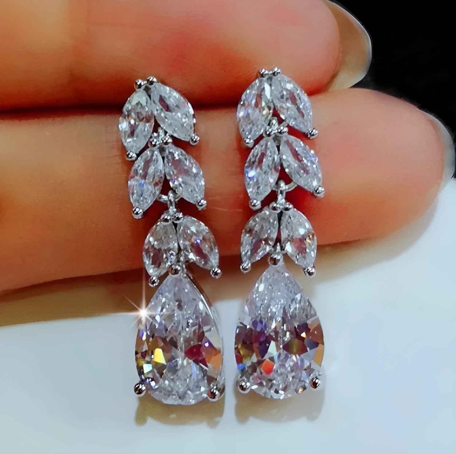 Silver alloy hoop earrings for women, no inlaid stones, lightweight design, two pairs shown on white background