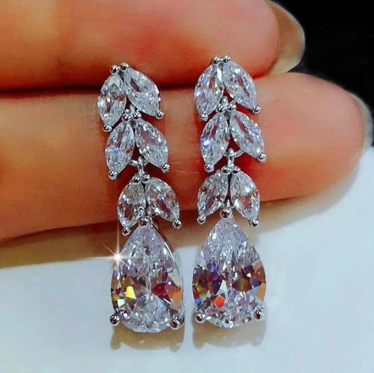 Silver alloy hoop earrings for women, no inlaid stones, lightweight design, two pairs shown on white background