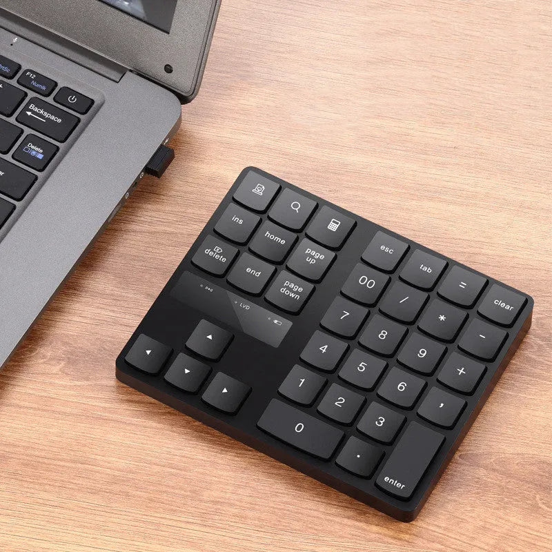 Black wireless 35-key numeric keyboard with compact ABS body and USB receiver