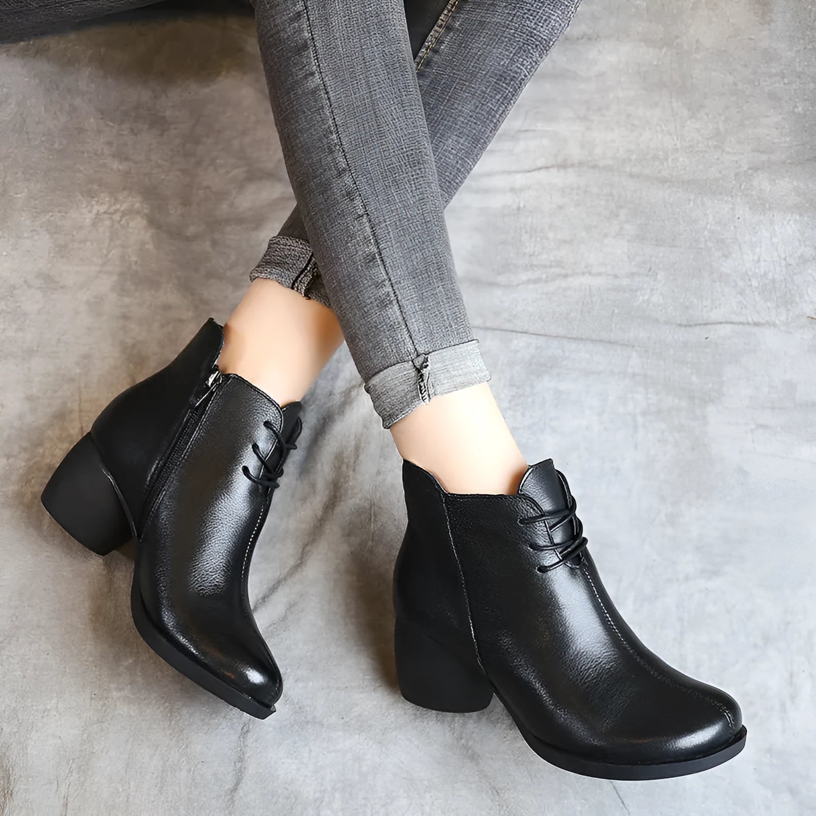 Brown leather women's Martin boots with a round toe and thick rubber sole.