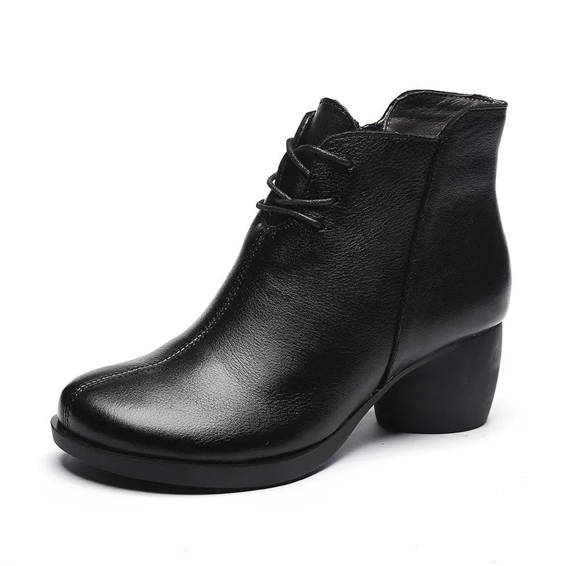 Brown leather women's Martin boots with a round toe and thick rubber sole.