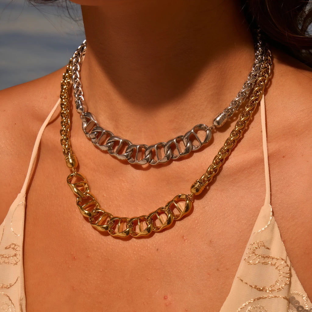 Gold electroplated stainless steel necklace with geometric pendant on regular chain