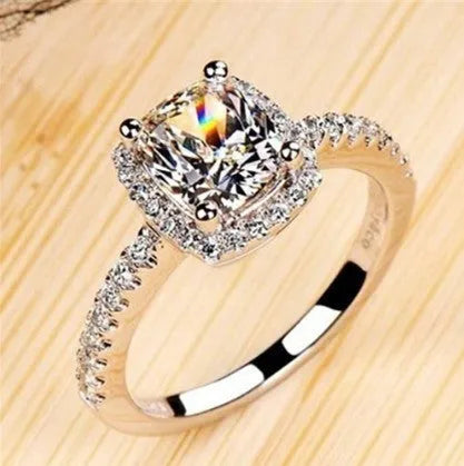 Silver alloy ring with artificial gemstone geometric inlay on white background
