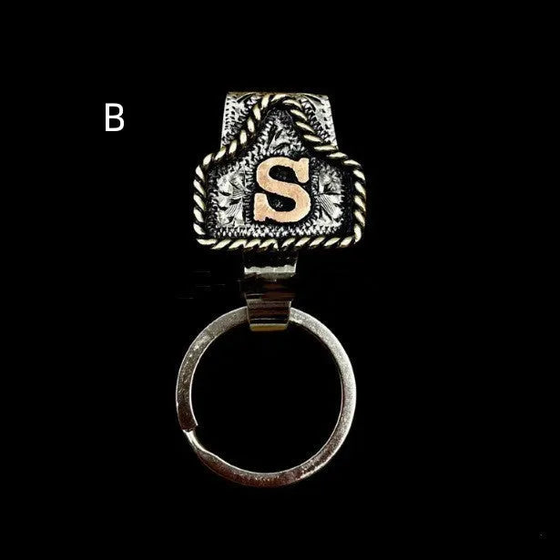 Handmade metal keychain with a cow tag charm in one of 26 available colour options.