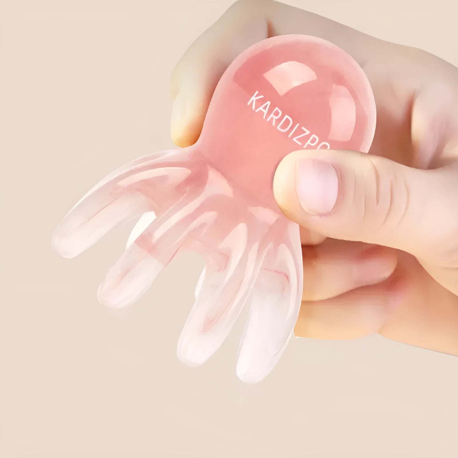 Pink octopus-shaped massage comb for facial meridian stimulation with storage bag