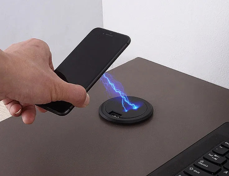 Round 60mm hidden wireless phone charger for installation in furniture.