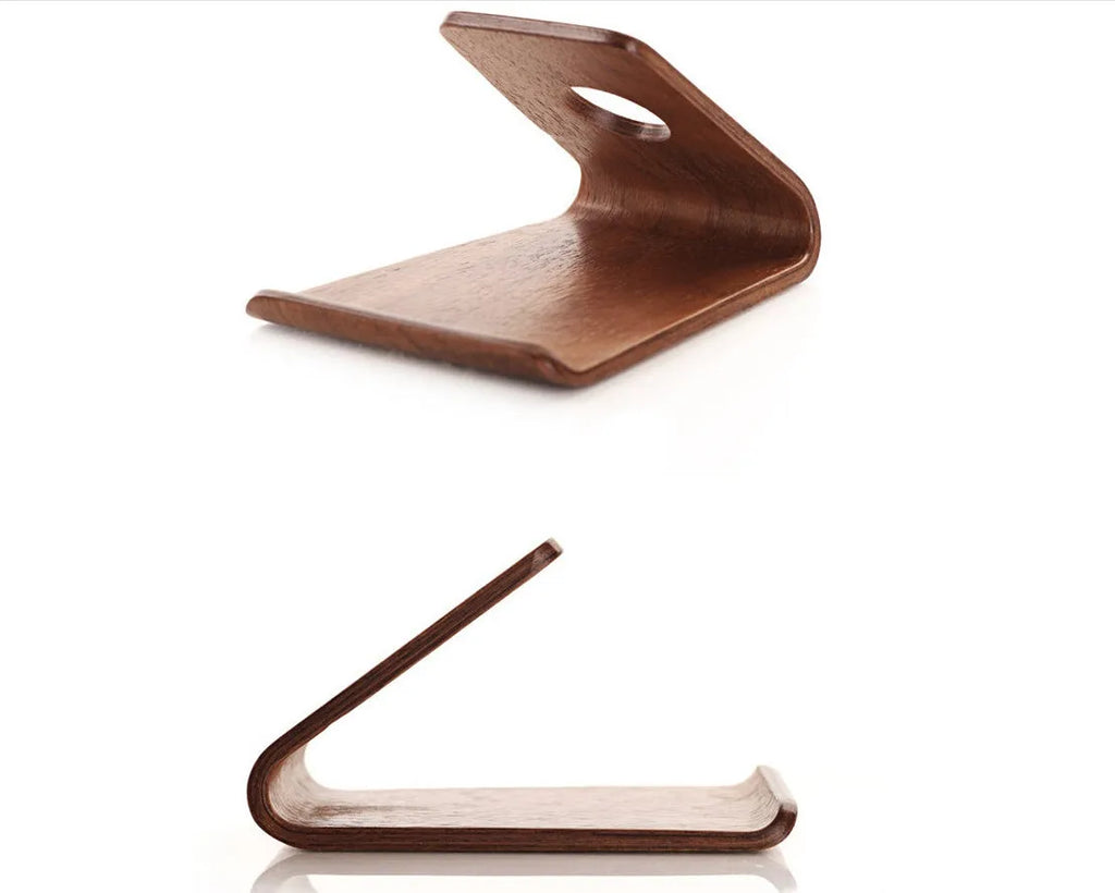 Solid wood iPhone stand in walnut finish on a desk
