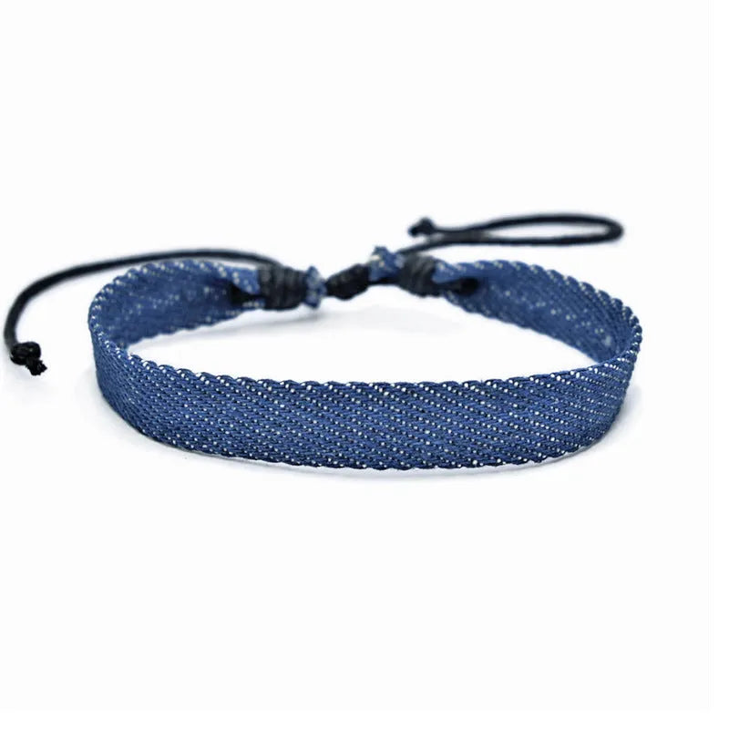 Denim fabric bracelet carrying strap with mixed materials, unisex design for travel