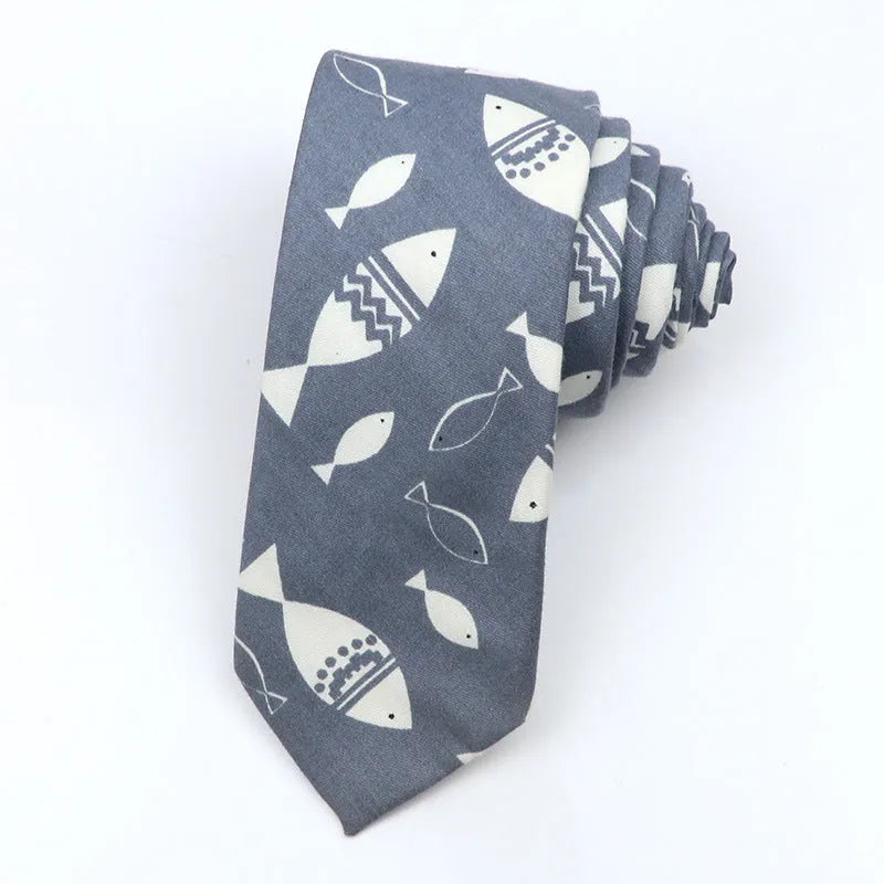 Narrow cotton bow tie with a printed cartoon pattern in a selection of colours.